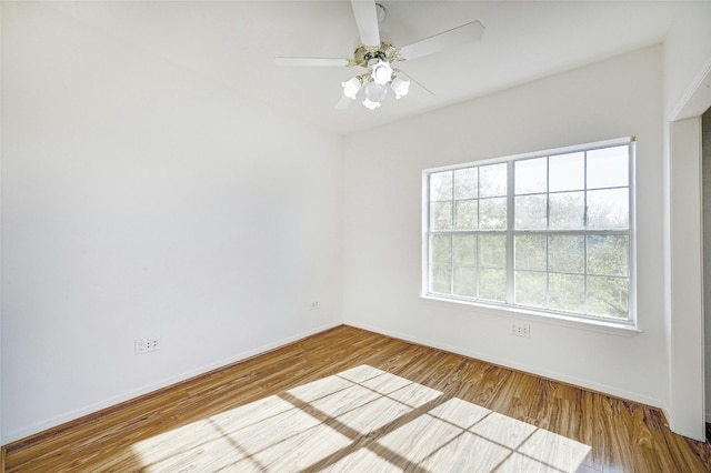 empty room featuring hardwood / wood-style floors and ceiling fan