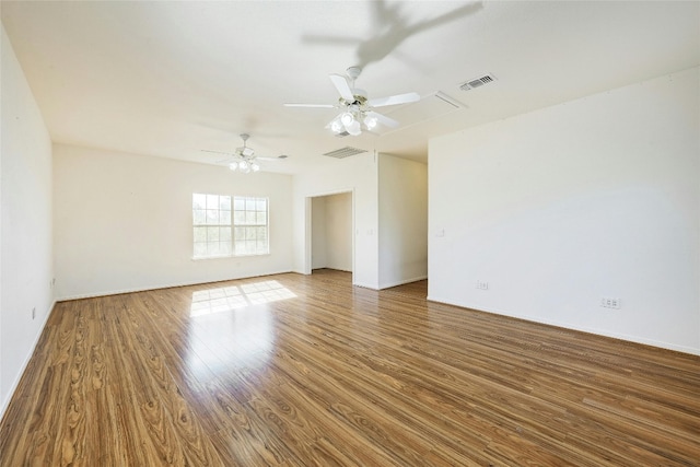 empty room featuring ceiling fan and hardwood / wood-style flooring