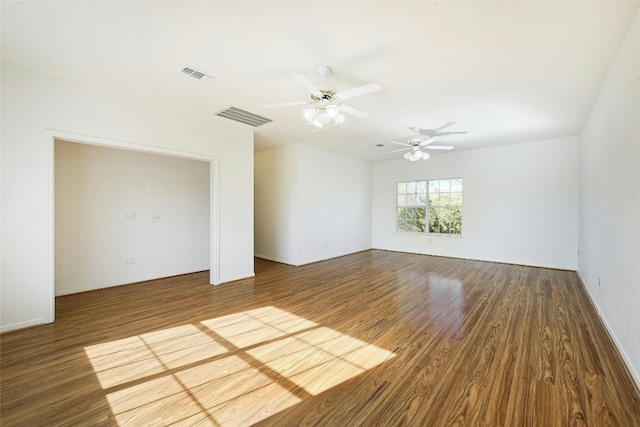 empty room featuring hardwood / wood-style floors and ceiling fan