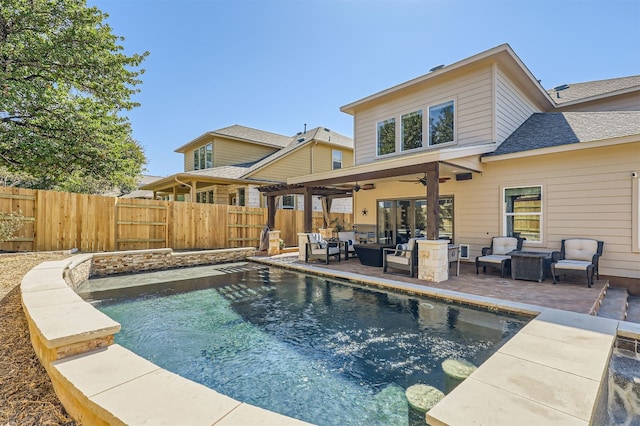 view of swimming pool with ceiling fan, an outdoor living space, and a patio area