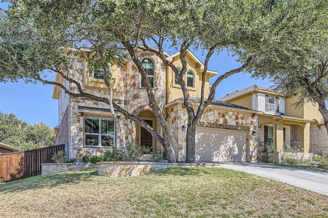 view of front of property with a garage and a front lawn