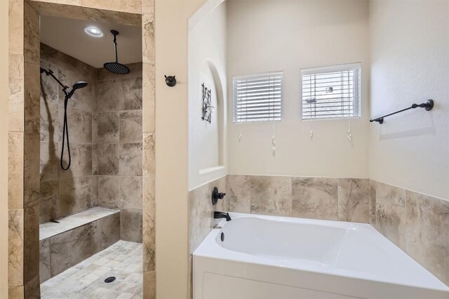 bathroom with shower with separate bathtub