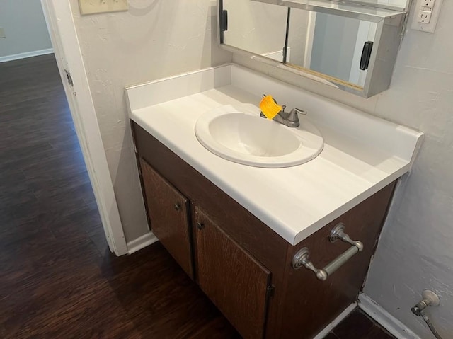 bathroom featuring vanity and hardwood / wood-style flooring