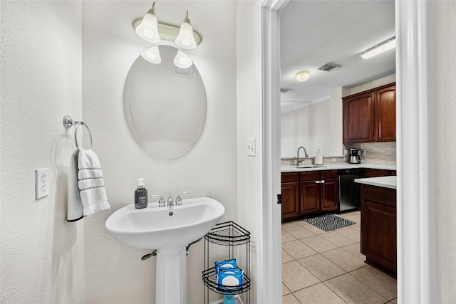 bathroom with sink and tile patterned flooring