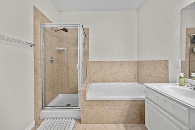 bathroom with vanity, independent shower and bath, and tile patterned floors