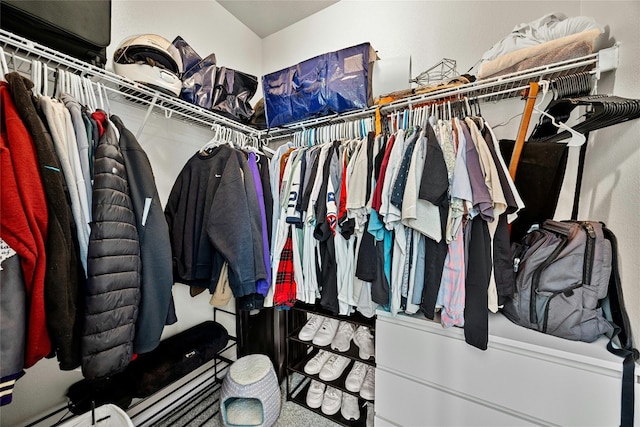 walk in closet featuring a baseboard heating unit