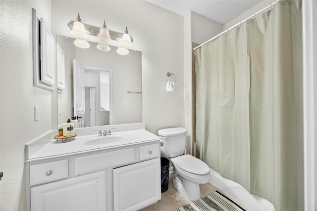 bathroom with toilet, vanity, tile patterned flooring, and curtained shower