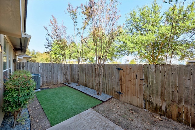 view of yard with central AC unit