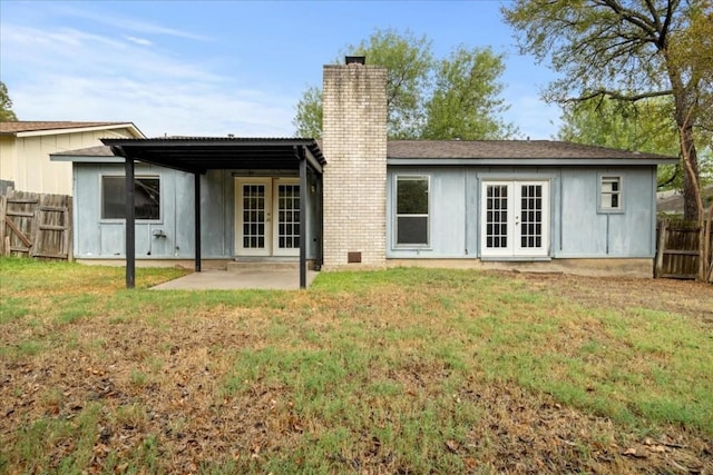 2803 Nordham Dr, Austin, TX 78745 - rear view of house featuring french doors, a chimney, and a patio