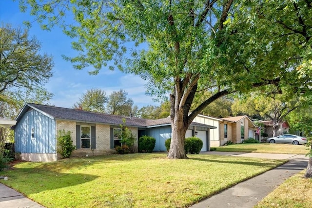 ranch-style house with a garage and a front lawn