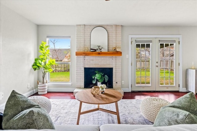 2803 Nordham Dr, Austin, TX 78745 - living room featuring wood finished floors, french doors, and a fireplace