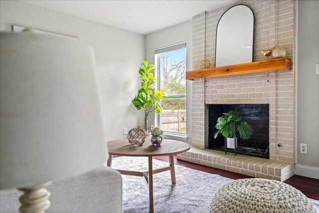 2803 Nordham Dr, Austin, TX 78745 - living room featuring wood finished floors and a brick fireplace