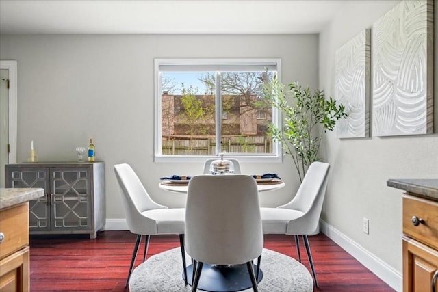 2803 Nordham Dr, Austin, TX 78745 - dining area featuring dark wood-style flooring and baseboards
