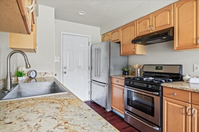 2803 Nordham Dr, Austin, TX 78745 - kitchen with stainless steel appliances, under cabinet range hood, and dark wood-style floors