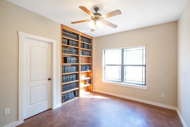 unfurnished room with concrete floors and ceiling fan