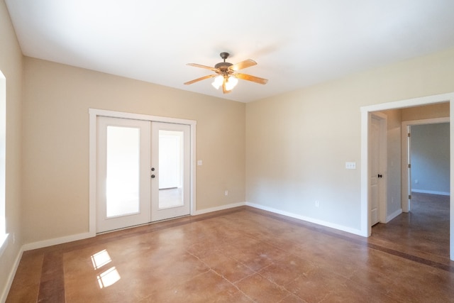 empty room featuring french doors and ceiling fan