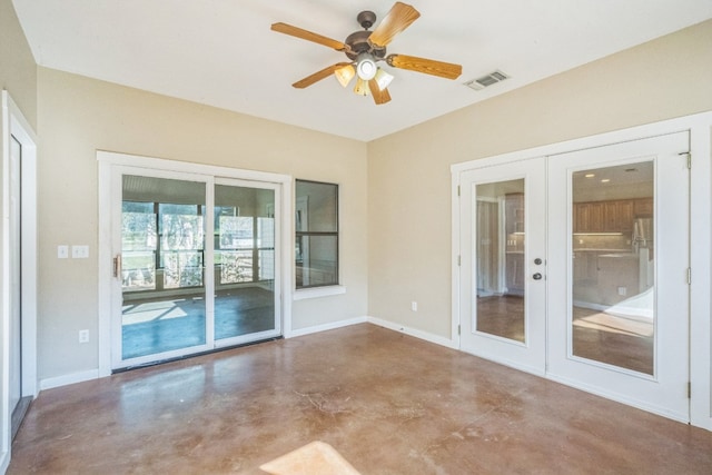 unfurnished room featuring ceiling fan and french doors