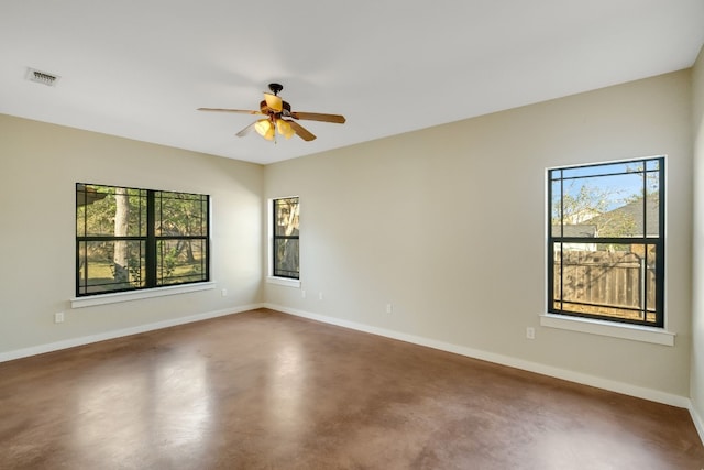 unfurnished room featuring concrete flooring and ceiling fan