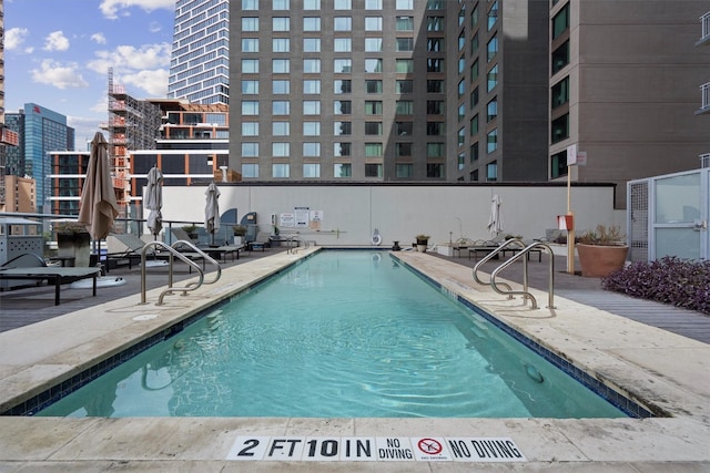 view of swimming pool with a patio area