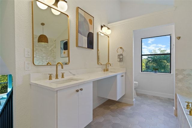 bathroom featuring vanity, toilet, lofted ceiling, and tile patterned flooring