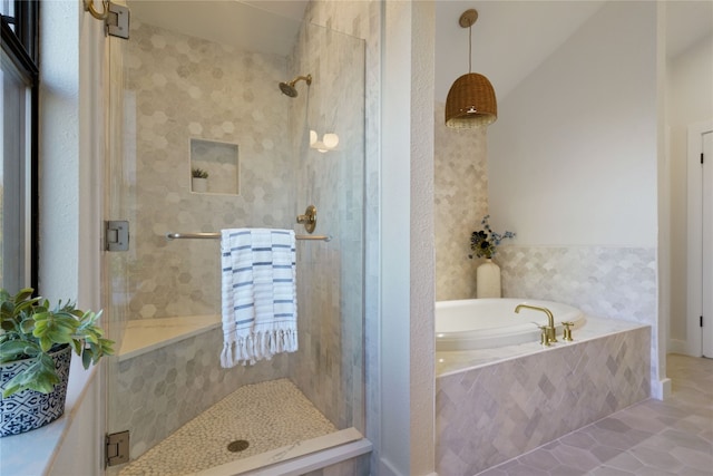 bathroom featuring tile patterned floors and plus walk in shower