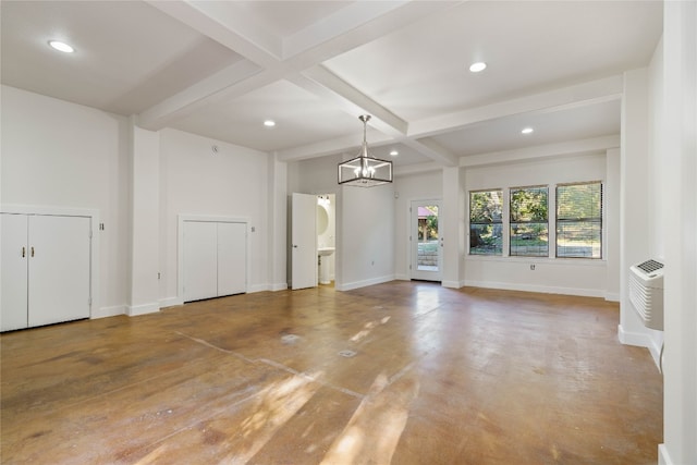 unfurnished room featuring a chandelier, beam ceiling, and coffered ceiling