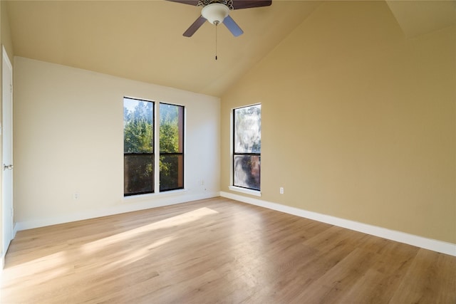 spare room with ceiling fan, high vaulted ceiling, and light hardwood / wood-style floors