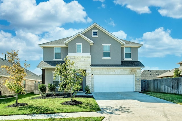 view of front of house with a front lawn and a garage