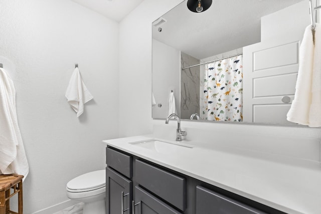 full bath with baseboards, a shower with shower curtain, toilet, marble finish floor, and vanity