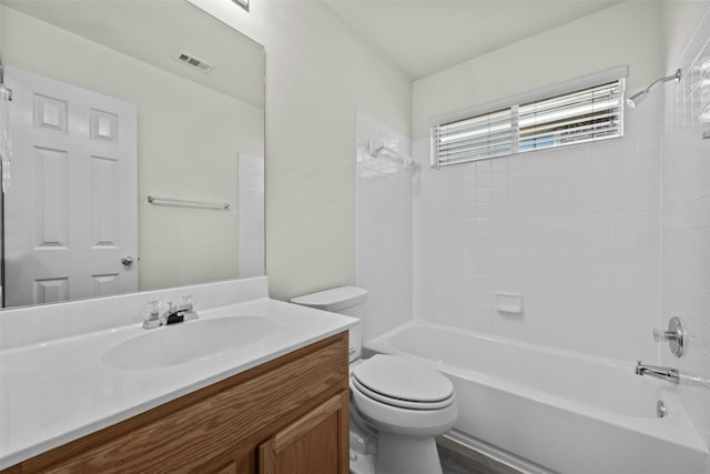 full bathroom featuring shower / tub combination, vanity, and toilet