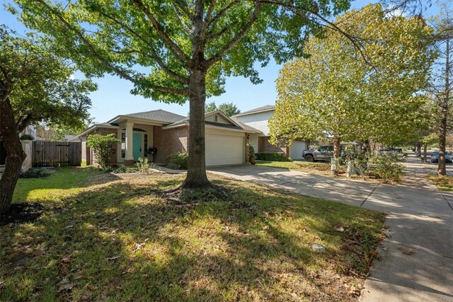 view of front facade featuring a front lawn and a garage