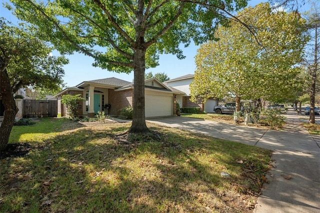 view of front of house featuring a garage and a front lawn