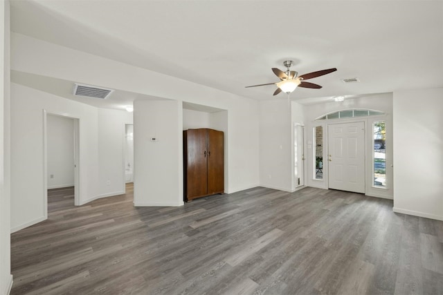 empty room with hardwood / wood-style flooring and ceiling fan