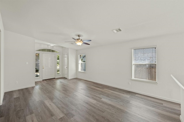 empty room featuring hardwood / wood-style floors and ceiling fan