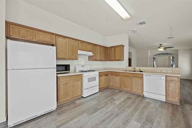 kitchen with sink, white appliances, light hardwood / wood-style flooring, ceiling fan, and kitchen peninsula