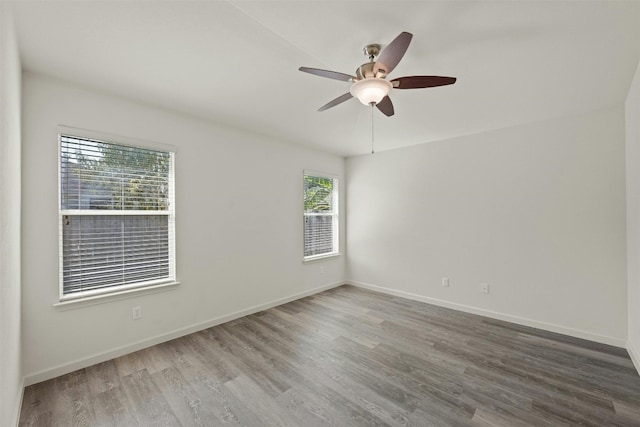 spare room featuring ceiling fan and wood-type flooring