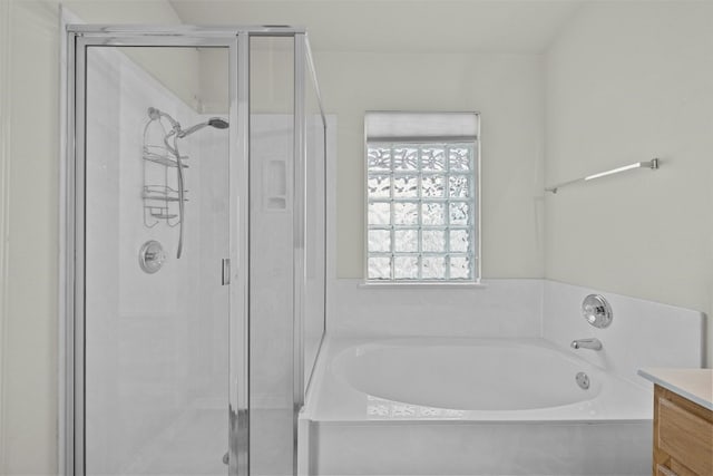 bathroom featuring independent shower and bath and vanity