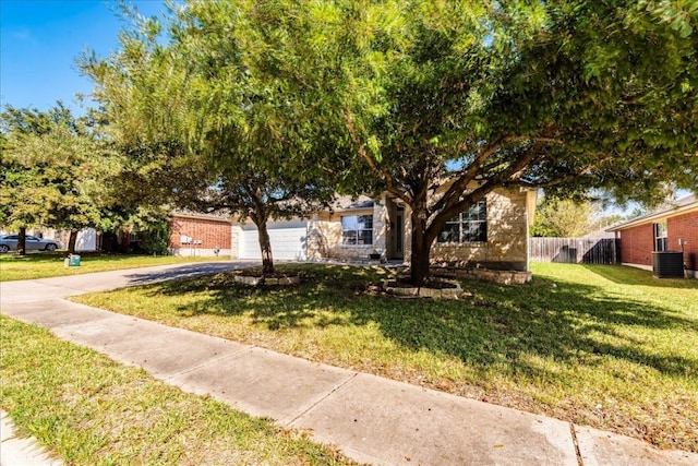 view of property hidden behind natural elements with a front yard