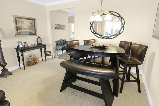 dining area featuring light colored carpet, baseboards, and ornamental molding