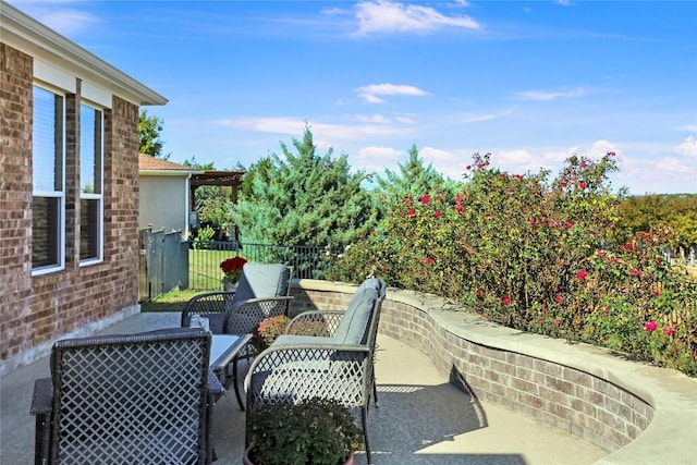 view of patio / terrace featuring fence