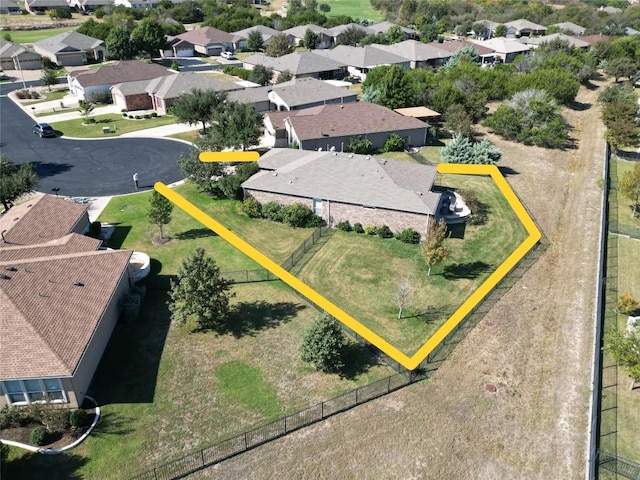 birds eye view of property with a residential view