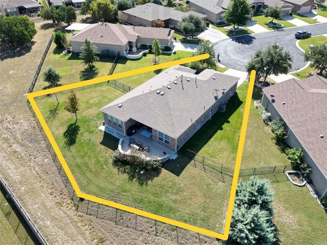 birds eye view of property with a residential view