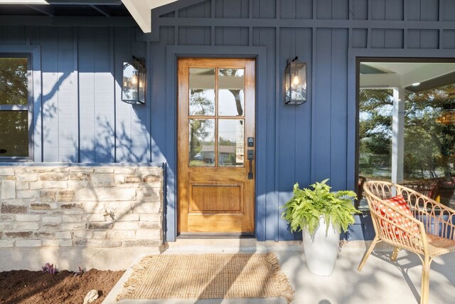 8000 Williamson Creek Dr, Austin, TX 78736 - doorway to property with covered porch and board and batten siding