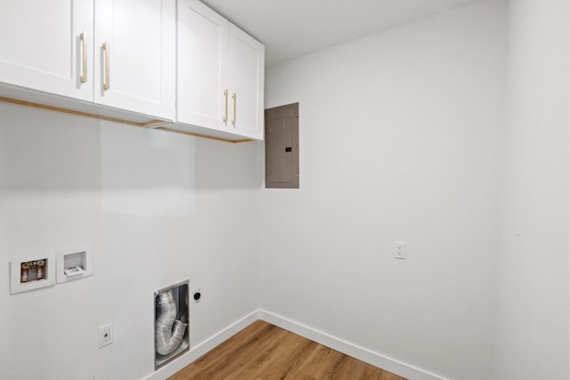 laundry area with cabinets, hookup for an electric dryer, light hardwood / wood-style flooring, electric panel, and hookup for a washing machine