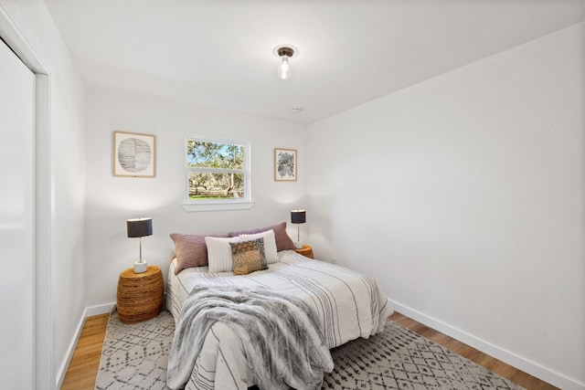 bedroom featuring wood-type flooring