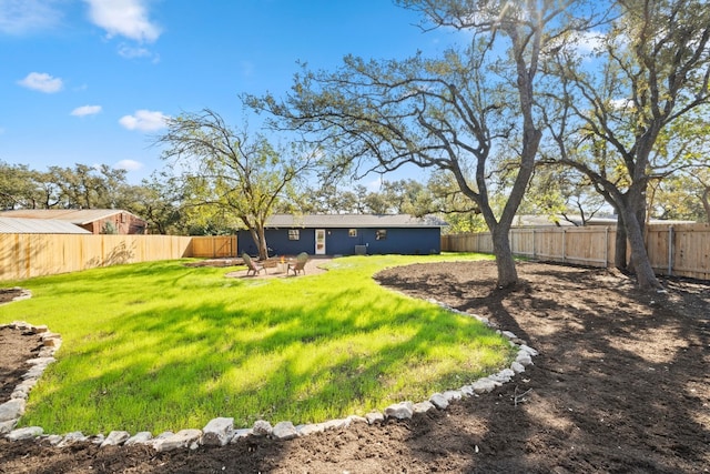 view of yard with an outdoor fire pit