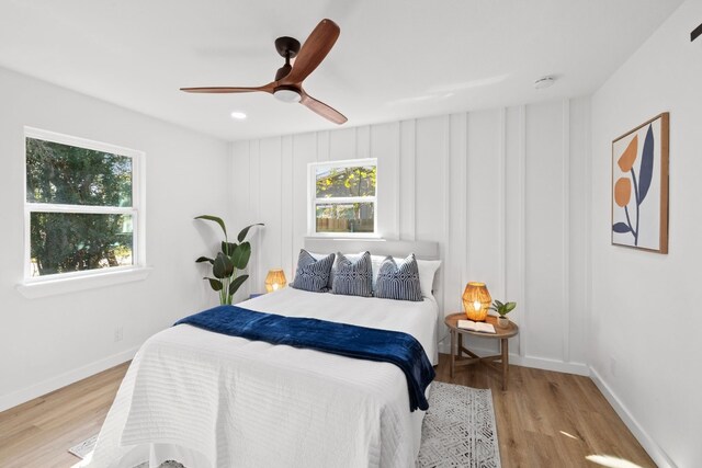 8000 Williamson Creek Dr, Austin, TX 78736 - bedroom featuring multiple windows, wood finished floors, a ceiling fan, and recessed lighting