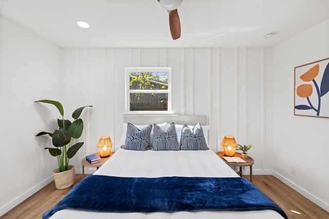 bedroom featuring light hardwood / wood-style floors and ceiling fan