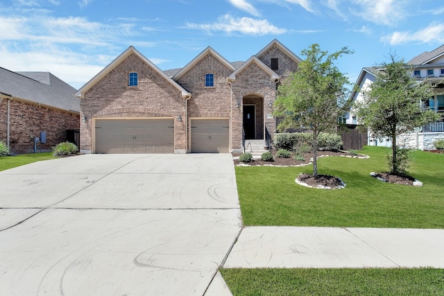 view of front of house featuring a front lawn, concrete driveway, and brick siding