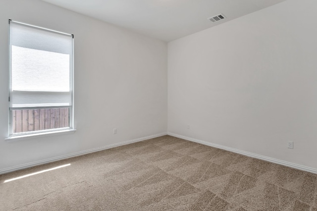 empty room featuring carpet flooring